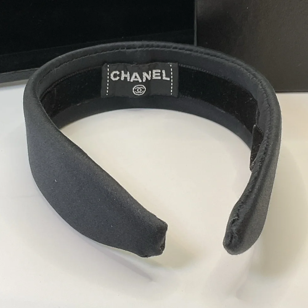 CHANEL Black Headband with Gold Logo Accent